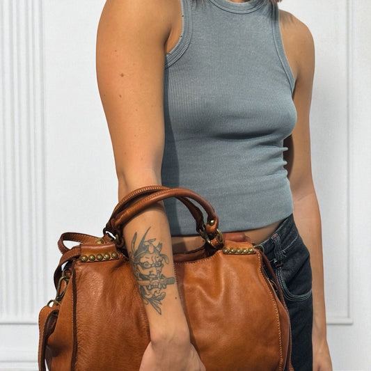 Bauletto in pelle decorato con laccetti e borchie - Mahzel